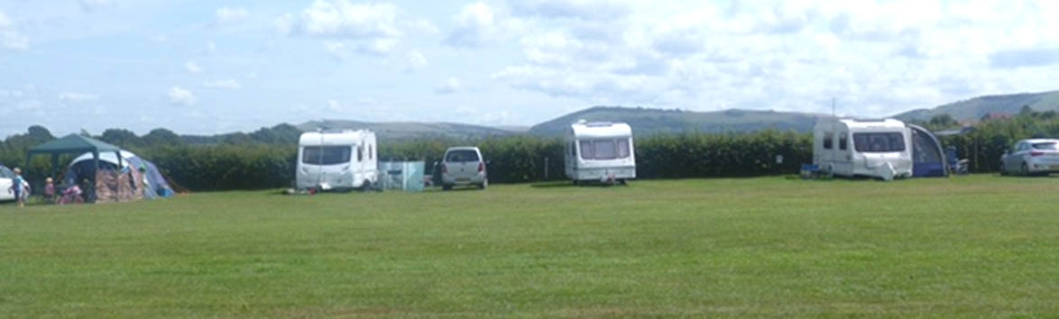 looking accros the filed at farm house campsite west sussex.