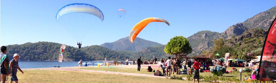 Paragliders landing on the beach at Olu Deniz in Turkey