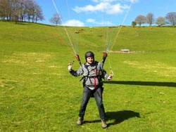Student demonstrates ground handeling a Paraglider. 